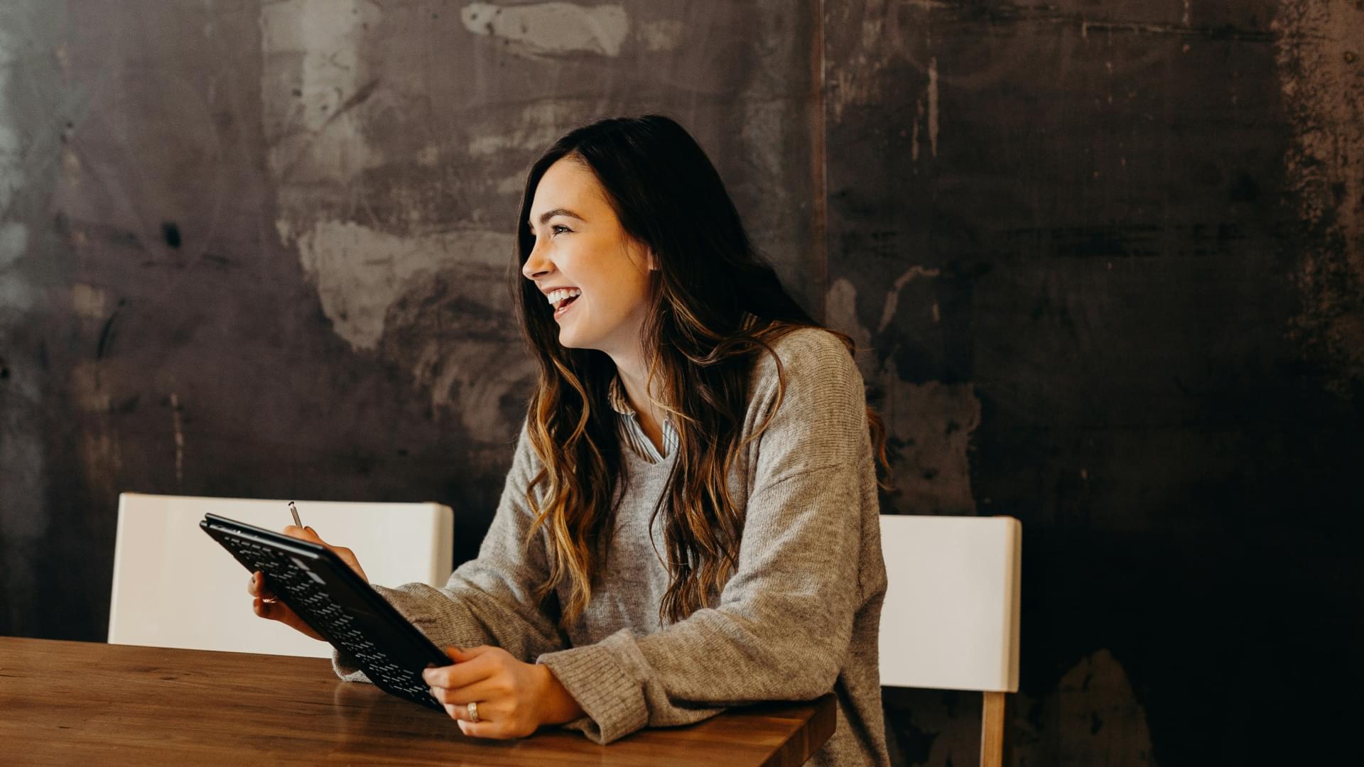 laughing women on ipad