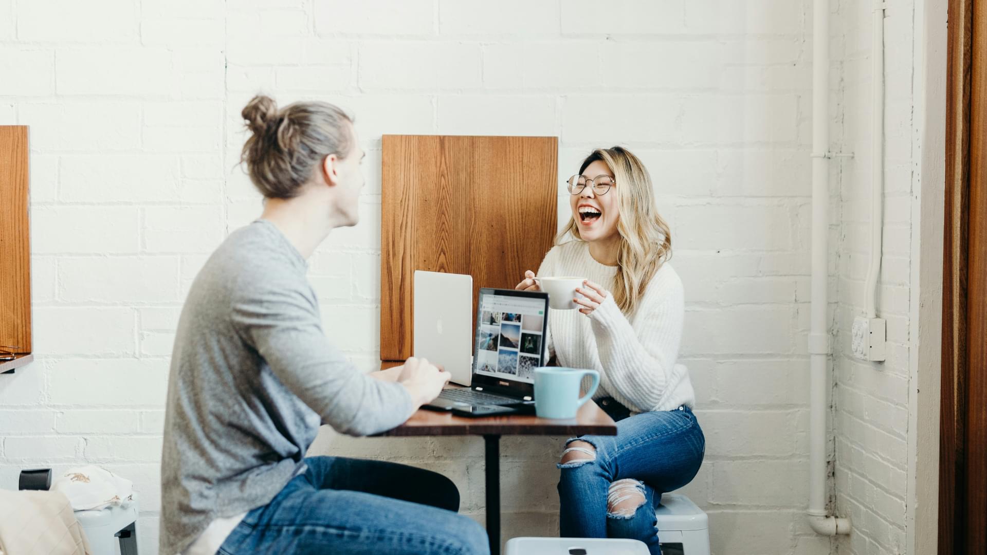 man women drinking coffee laughing