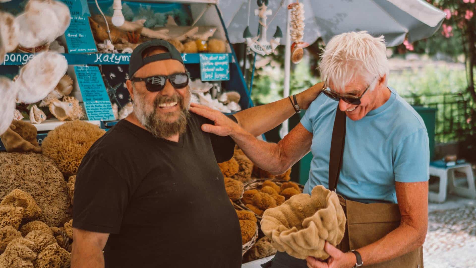 two men laughing at market