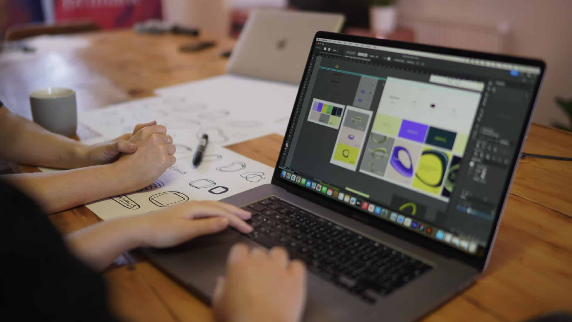 Brand visual elements on laptop screen