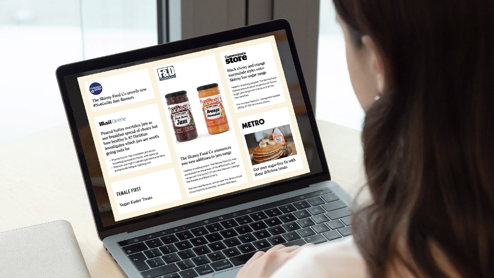 PR clippings on laptop screen