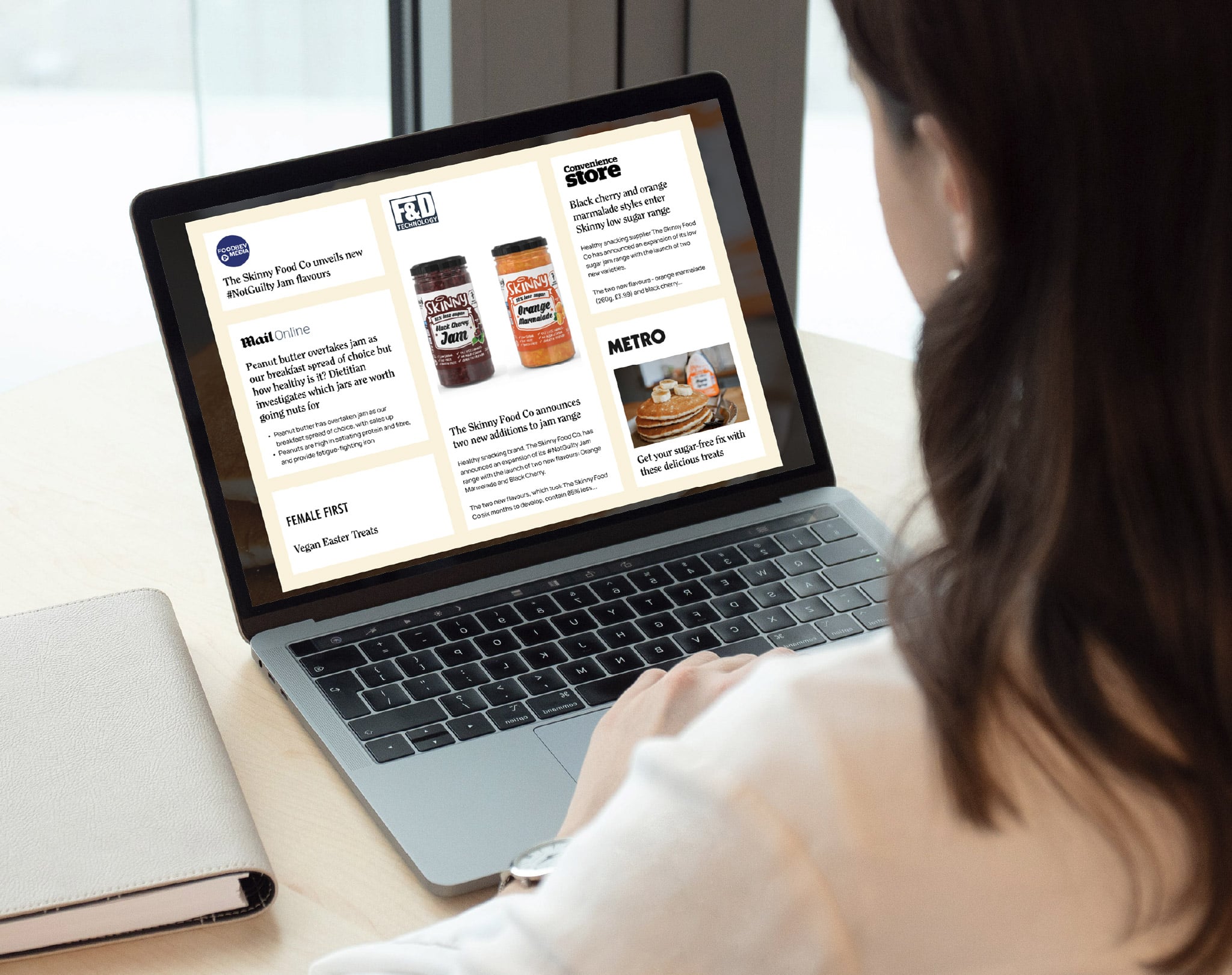 PR clippings on laptop screen