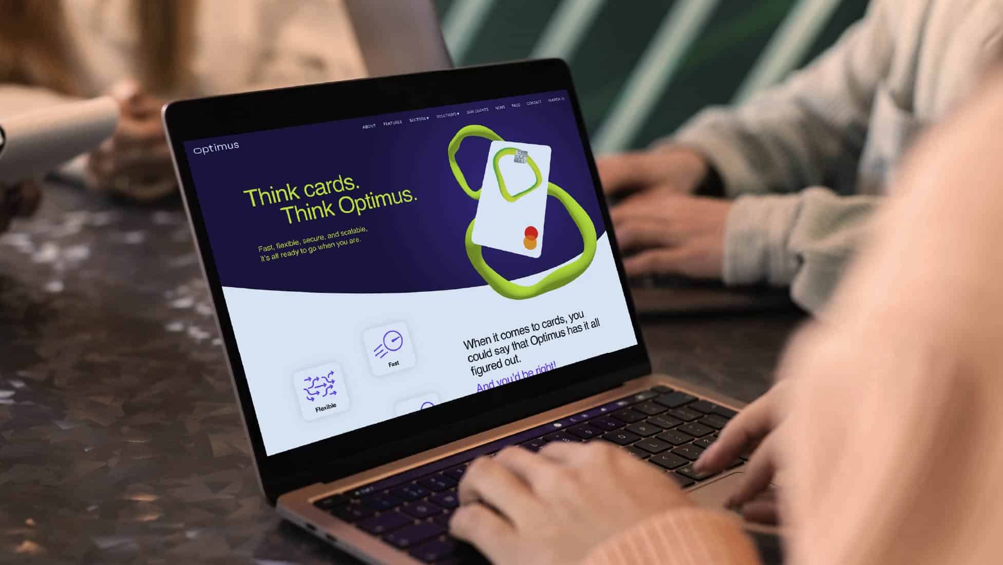 laptop screen showing Optimus cards website