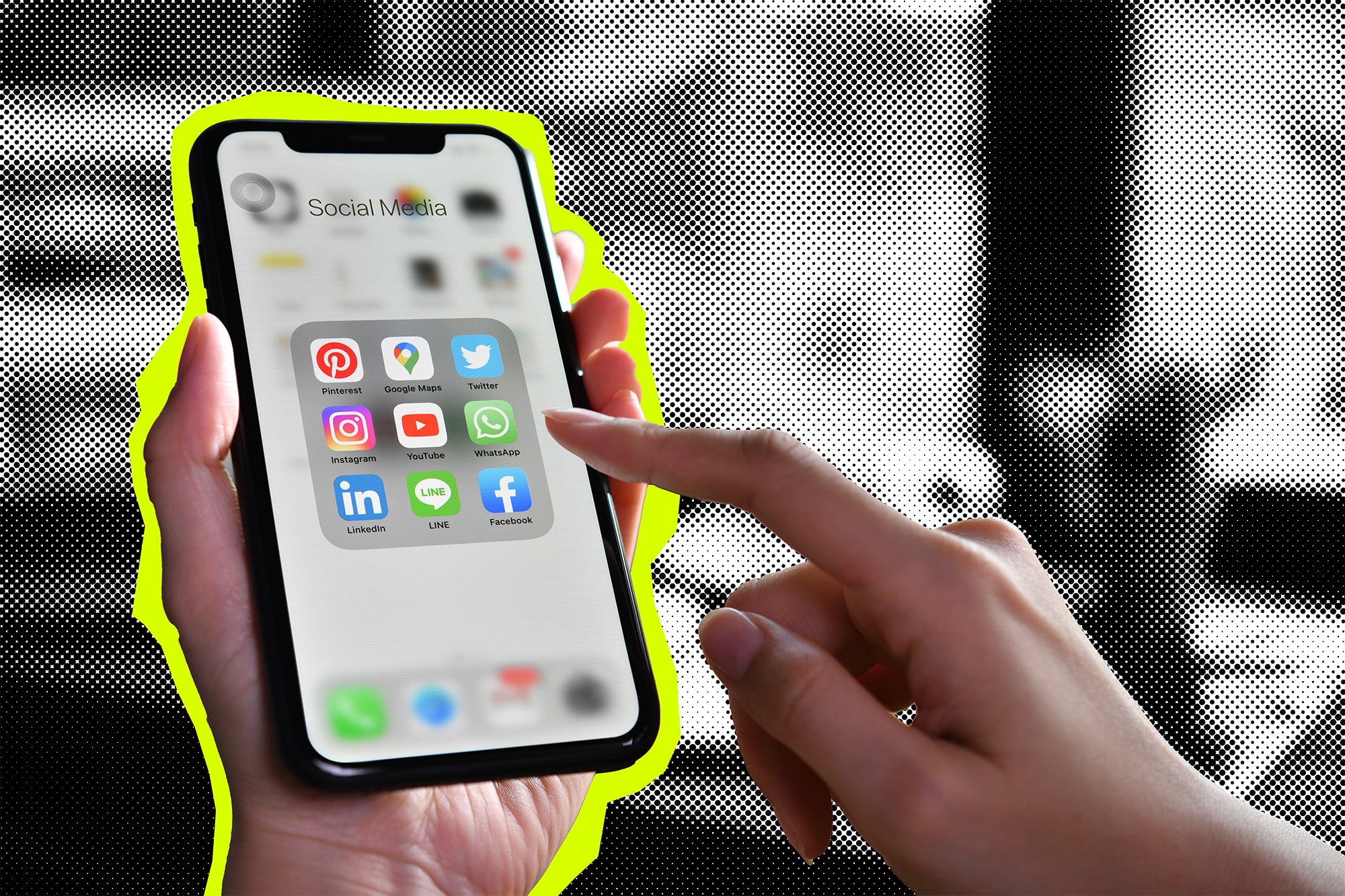 Mobile phone with finger pointing at social media icons