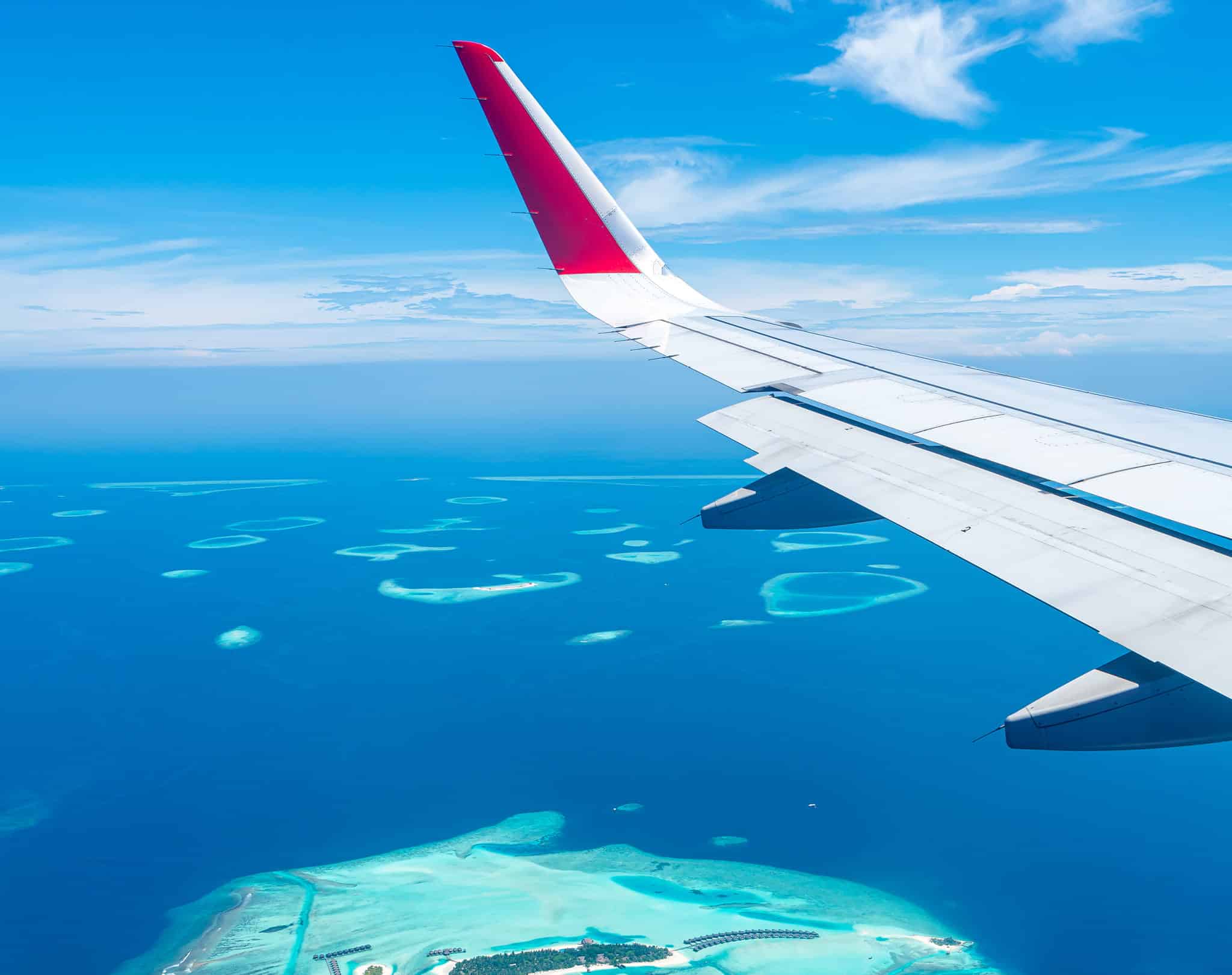 Plane flying over island