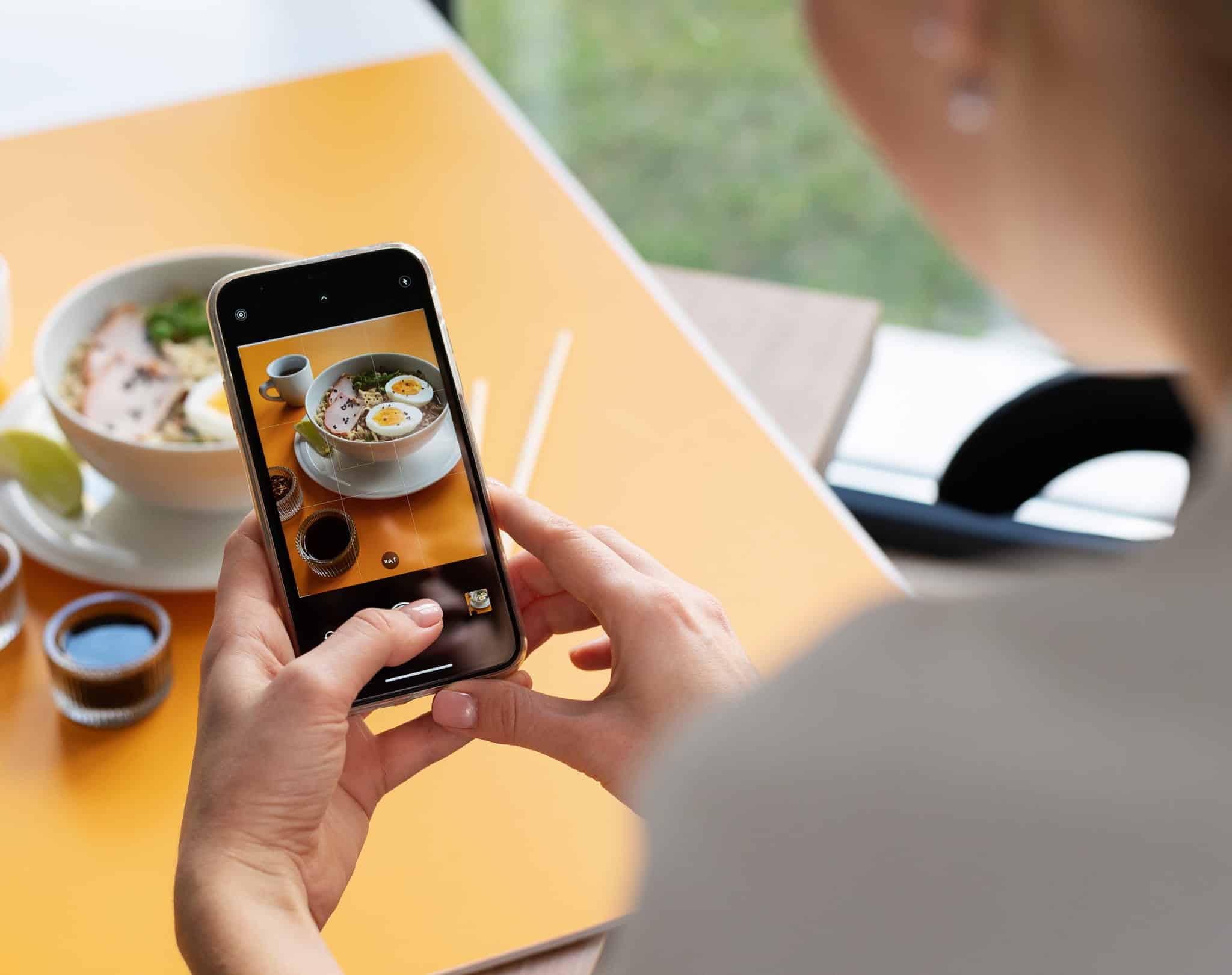 Taking photo of plate of food