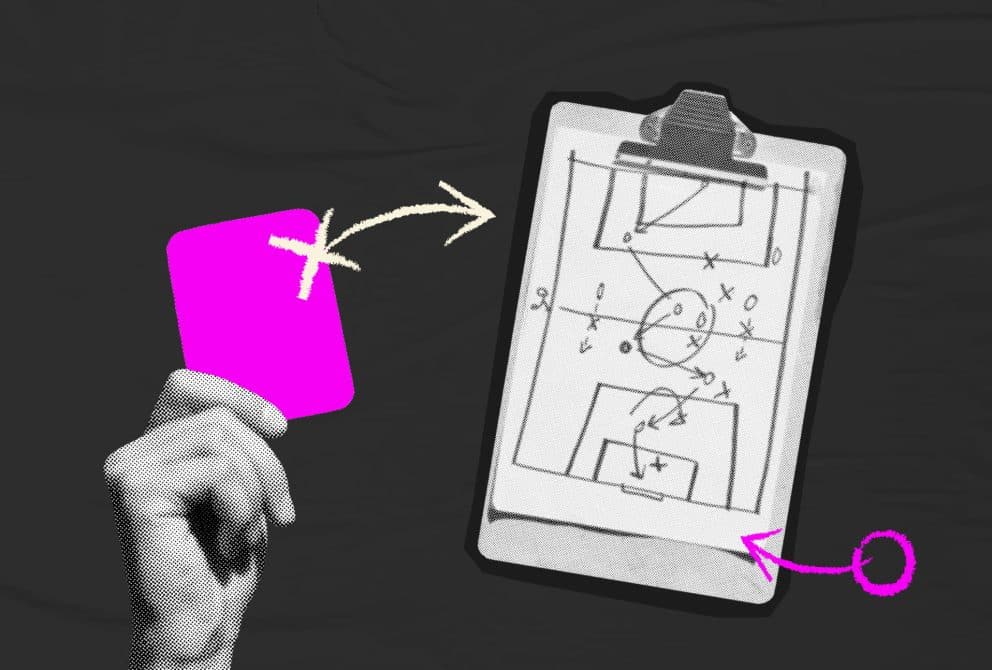 hand holding pink cars and strategy clipboard